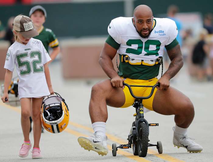 Running back AJ Dillon takes a slightly undersized bike to Packers training camp. (Dan Powers/USA Today Sports Images)